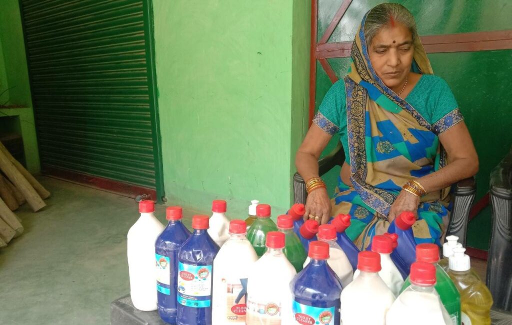 Women becoming self-sufficient by making phenyl at home